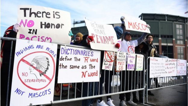 Protesters picket a game in 2019