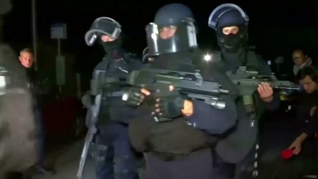 Still image taken from video shows police arriving at the scene near where a French police commander was stabbed to death in front of his home in the Paris suburb of Magnanville, France, early on 14 June 2016