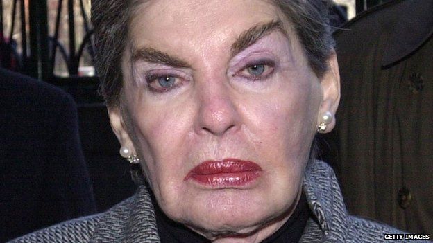 Real estate mogul Leona Helmsley is aided by her body guards as she arrives to court on 23 January 2003 in New York City.