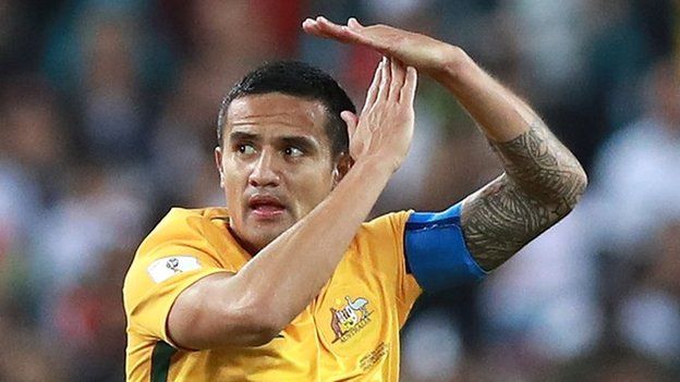 Tim Cahill making a T sign with his hands after he kicked a goal in a World Cup qualifying match.