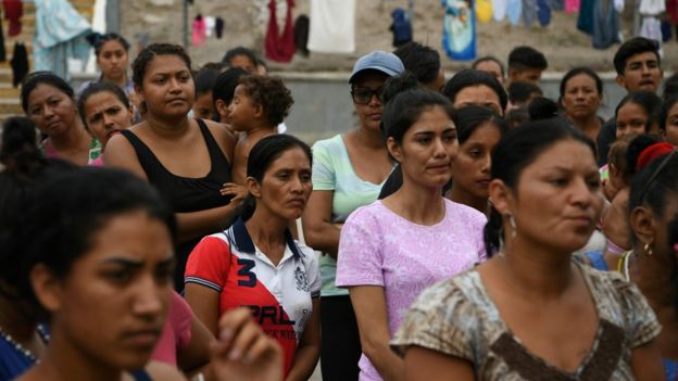 Migrants near the US port of entry at the Gateway International Bridge in Matamoros, Tamaulipas, Mexico, 24 August