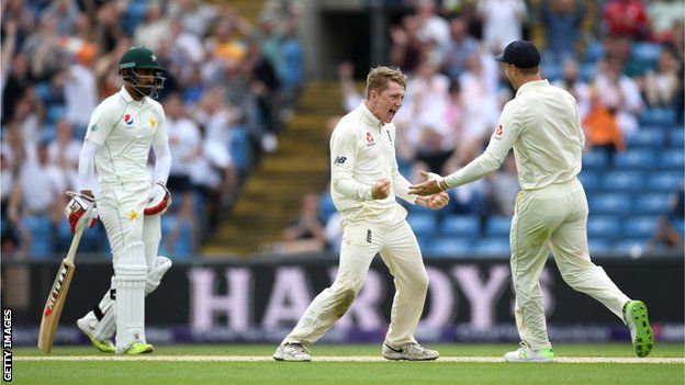 England spinner Dom Bess (centre) celebrates dismissing Pakistan batsman Imam-ul-Haq (left)
