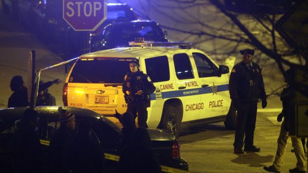 Police officers attend Mercy Hospital after a gunman shot multiple people, 19 November 2018