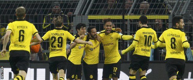 Borussia Dortmund players celebrate a goal against Stuttgart