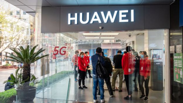 Customers at a Huawei shop in Shanghai