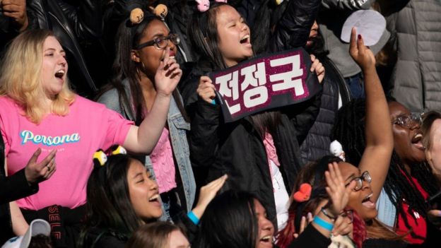 Fans cheer as K-Pop group BTS performs in Central Park, May 15, 2019 in New York City
