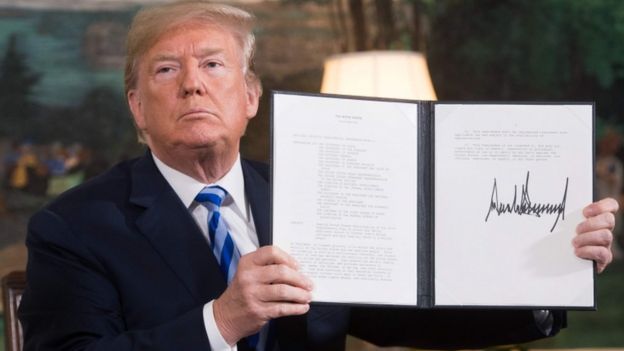 Donald Trump signs a document reinstated sanctions