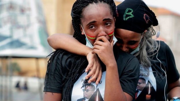 Members of the Oromo Ethiopian community in Lebanon mourn as they take part in a demonstration to protest the death of musician and activist Hachalu Hundessa, in the capital Beirut on July 5, 2020