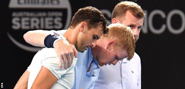 Grigor Dimitrov comes to Kyle Edmund's aid after the Briton rolls his ankle in Brisbane