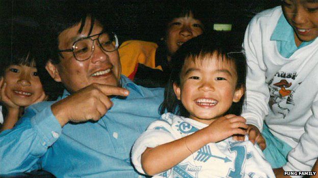 A young Tim Fung with his dad
