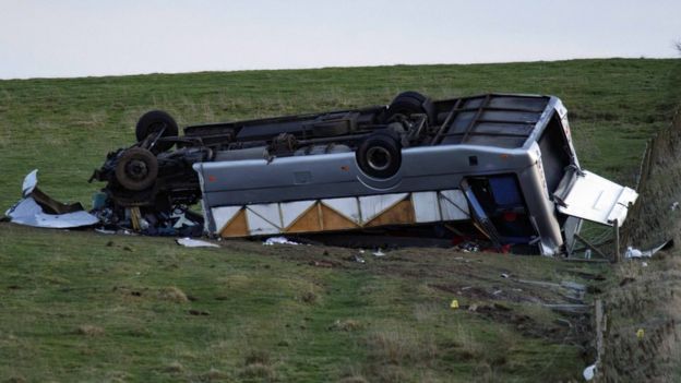 Upturned bus in field in Scottish Borders.
