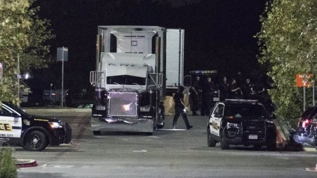 Officials investigate a truck that was found to contain 38 suspected illegal immigrants in San Antonio, Texas, USA, 23 July 2017