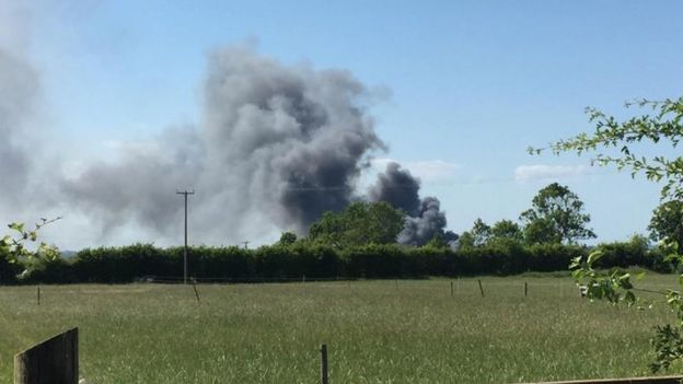 Plumes of smoke rising from the Corkers Crisps factory in Pymoor, Cambridgeshire