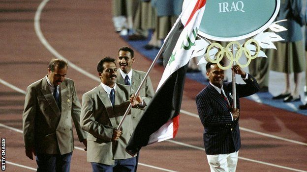 Raed Ahmed carrying the Iraq flag at the opening ceremony for Atlanta 1996