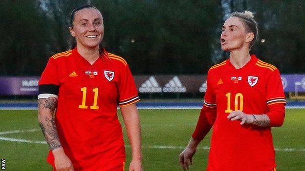 Natasha Harding and Jess Fishlock joking on the pitch after Wales v Canada friendly