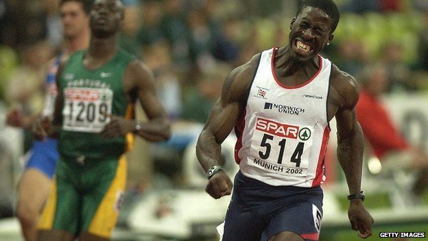 Dwain Chambers celebrates winning the men's 100m final at the European Championships at the Olympic Stadium in Munich, Germany in August 2002