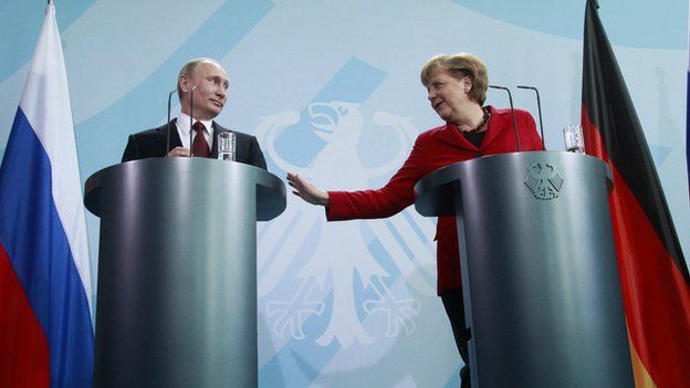Putin and Merkel at a press conference