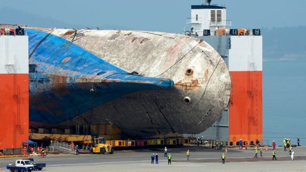 The salvaged Sewol ferry is moved onto land by module transporters to be put on a dry dock at a port in Mokpo, 410 km southwest of Seoul, South Korea, 9 April 2017
