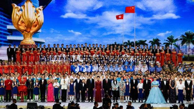 Chinese President Xi Jinping (centre-right, wearing red tie) sings a song entitled 