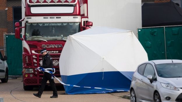 Officers inspect a lorry in Essex after finding 39 bodies inside