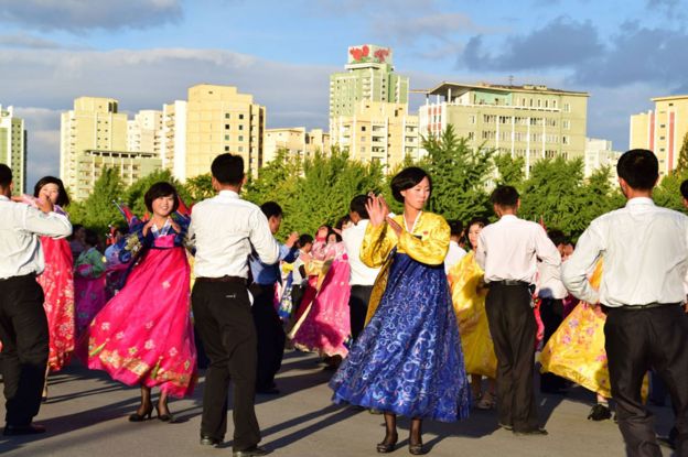 Folk dancing outdoors in Pyongyang