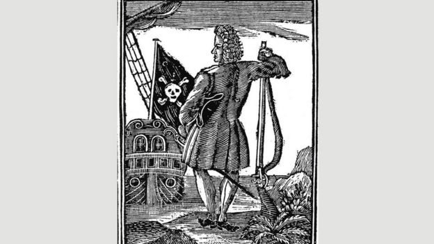 Un dibujo de un hombre observando la bandera pirata ondear
