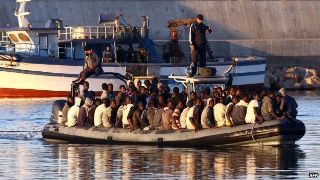 Sub-Saharan African migrants are rescued by the Libyan coastguard after their inflatable boat started to sink off the coastal town of Guarabouli
