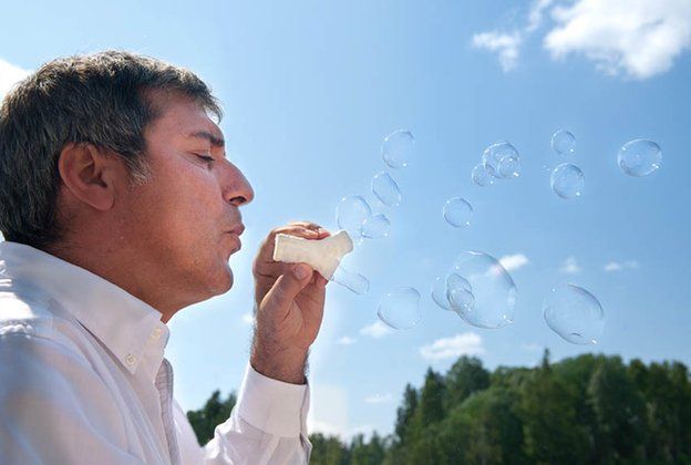 Macchiarini blowing bubbles through his synthetic tracheas