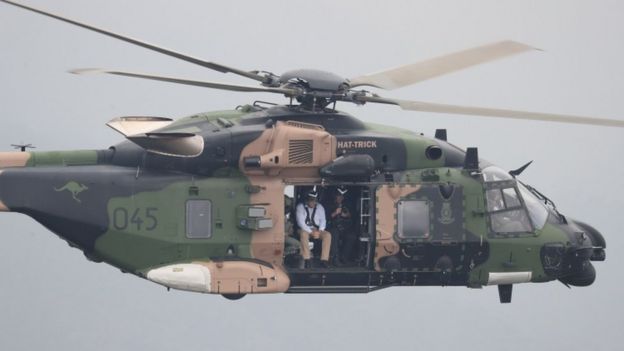 Australia's Prime Minister Scott Morrison, pictured here on 23 December, flying over bushfires in an Australian Defence Force helicopter in NSW