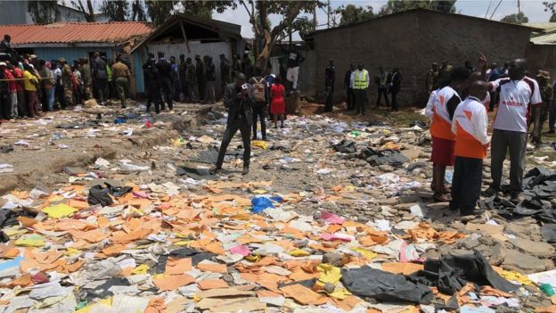 Emergency workers at the site where a school building collapsed