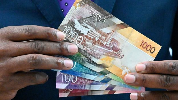 Patrick Njoroge displays some of the new designs for the Kenyan currency notes