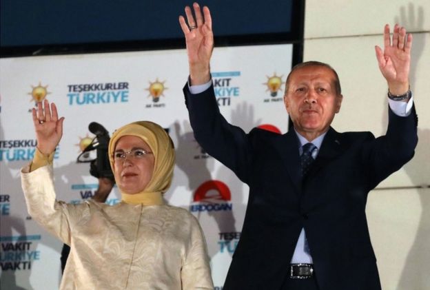 Turkey's President Recep Tayyip Erdogan and his wife Emine Erdogan greet supporters gathered at the AK Party headquarters in Ankara, Turkey