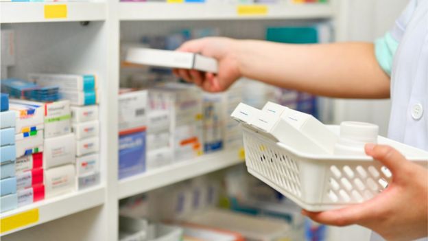 A pharmacist sorting medicines