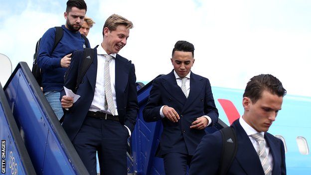 Frenkie de Jong (L) and Abdelhak Nouri of Ajax arrive with team mates ahead of the UEFA Europa League Final between Ajax and Manchester United at Stockholm Arlanda Airport on May 23, 2017 in Stockholm, Sweden.