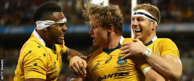 Michael Hooper is congratulated on his try for Australia