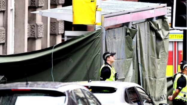 a bus shelter has been covered by police at the scene