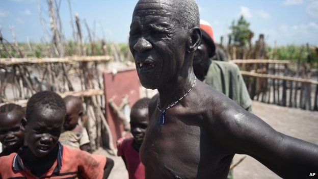 South Sudanese man whose home was burned by soldiers and militiamen.