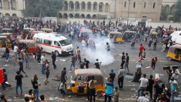 Demonstrators disperse as Iraqi security forces use tear gas in Baghdad