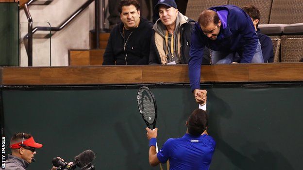 Novak Djokovic greets tennis legend Pete Sampras after his win over Bjorn Fratangelo at Indian Wells