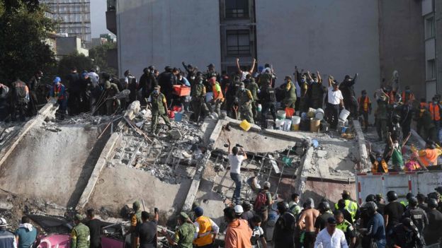  Rescuers and volunteers tried to find survivors under the debris of collapsed buildings 