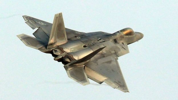 A US Air Force F-22 Raptor stealth jet flies over the air base at Gwangju as joint military exercises with South Korea get under way