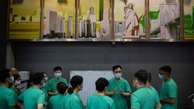 Medical staff work at a temporary facility set up for COVID-19 patients at the AsiaWorld Expo in Hong Kong, China, 01 August 2020.