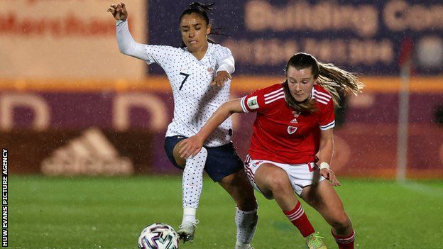 Womens World Cup Qualifiers - Carrie Jones of Wales is challenged by Sakina Karchaoui of France