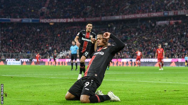 Leon Bailey celebrates scoring for Leverkusen against Bayern Munich