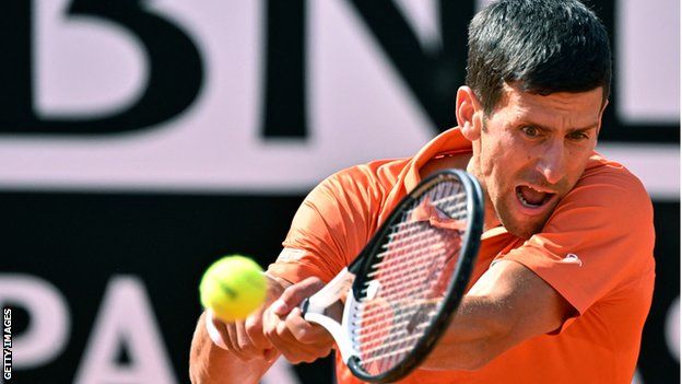 Novak Djokovic returns a ball in his Italian Open second round match against Aslan Karatsev