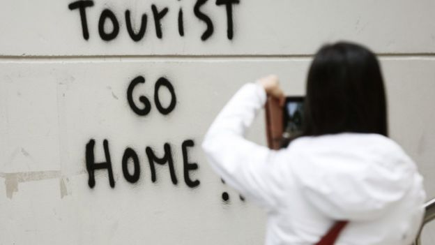 Tourist Go Home sign
