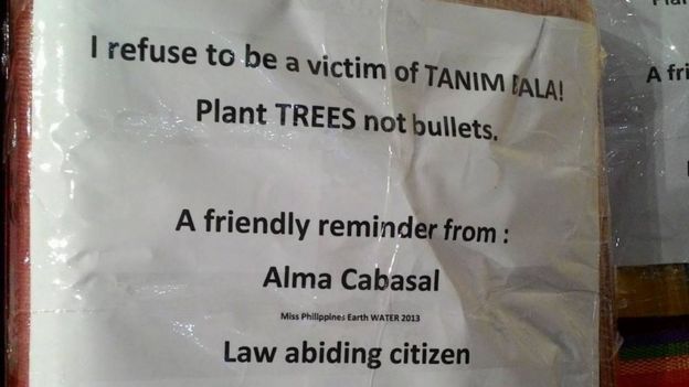 This grab taken from the Instagram account from former Miss Philippines Earth Alma Cabasal, shows an anti-Tanim Bala sign she wrote and attached to her luggage