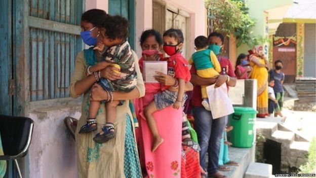 Parents and caregivers lined up with their children at an immunisation clinic in Janakpur Sub-Metropolitan City in southern Nepal.