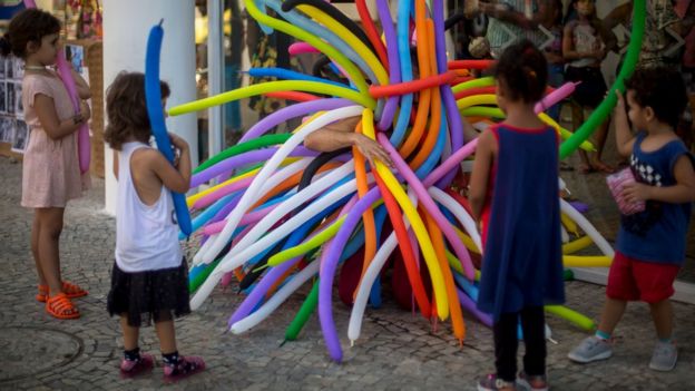 Artist Felipe Vasconcelos performs during a rally held by artists and demonstrators called 