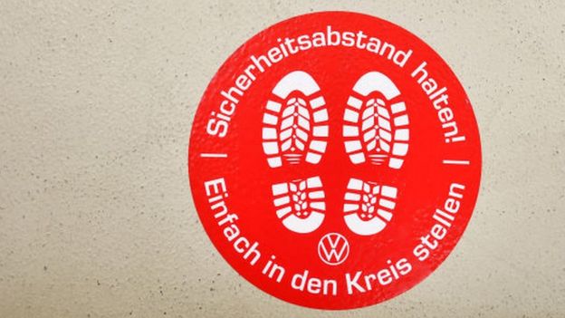 A sign at Volkswagen's Wolfsburg factory reminding staff to keep a safe distance from others